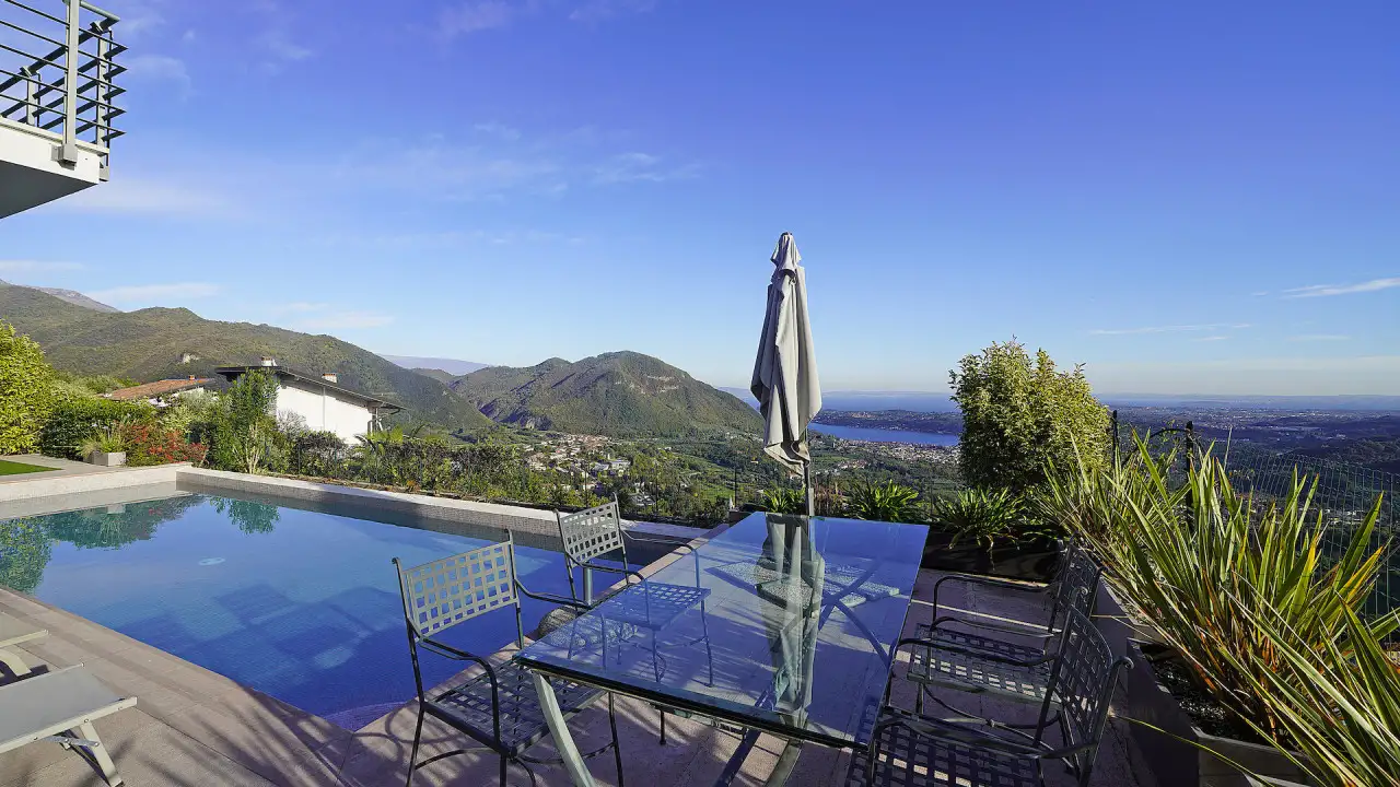 Infinity pool with metal table and chairs