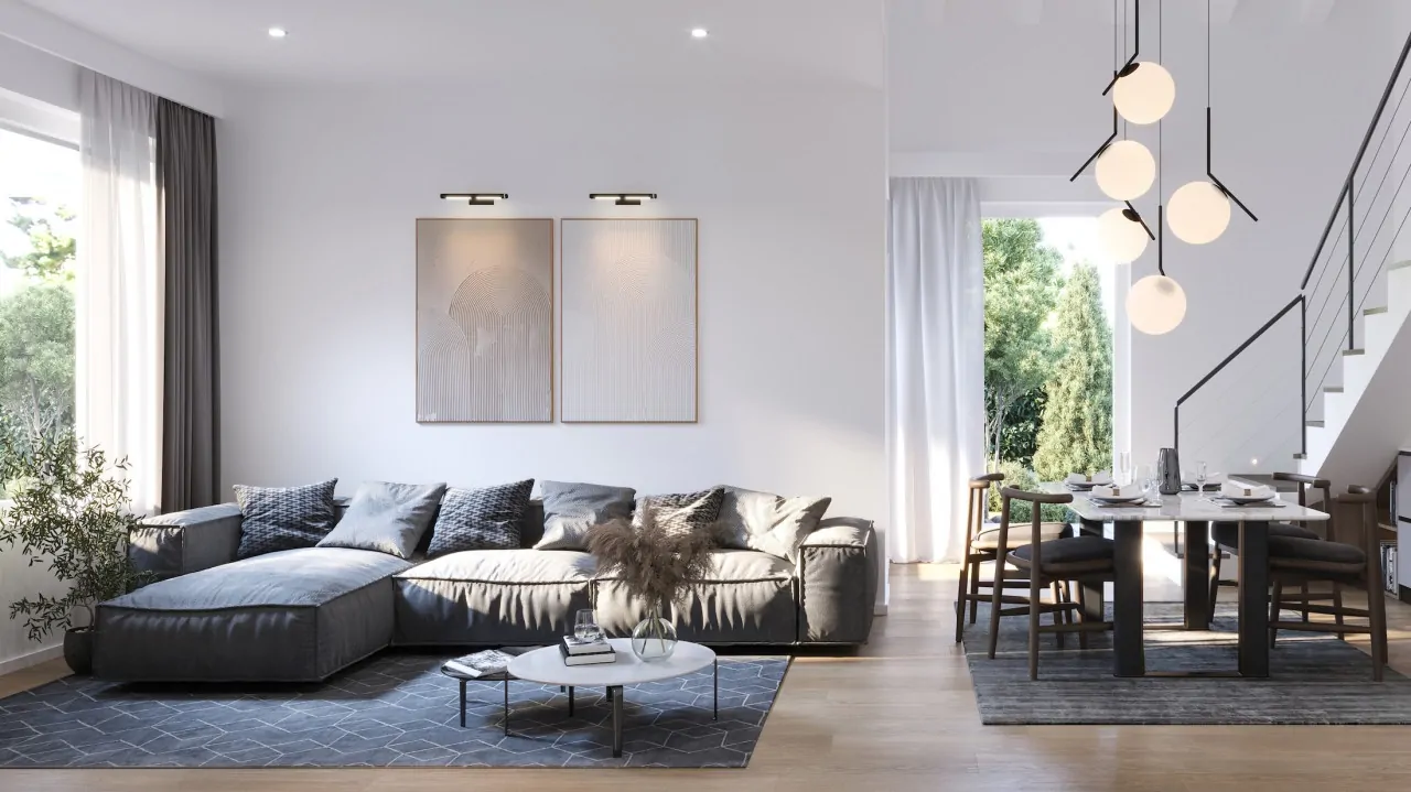 Wohnzimmer mit Ecksofa und Esstisch neben der Innentreppe
