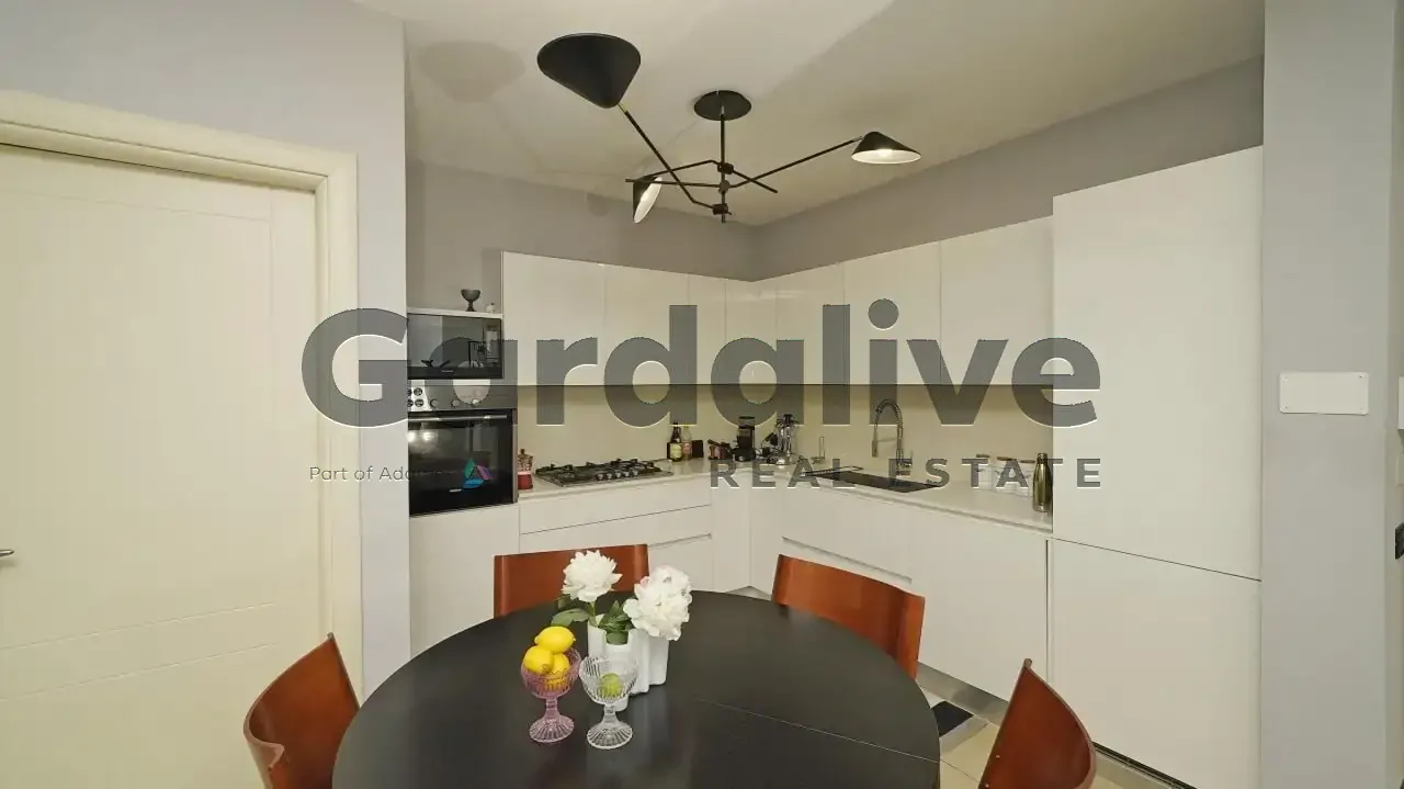 Kitchen with round table and wooden chairs