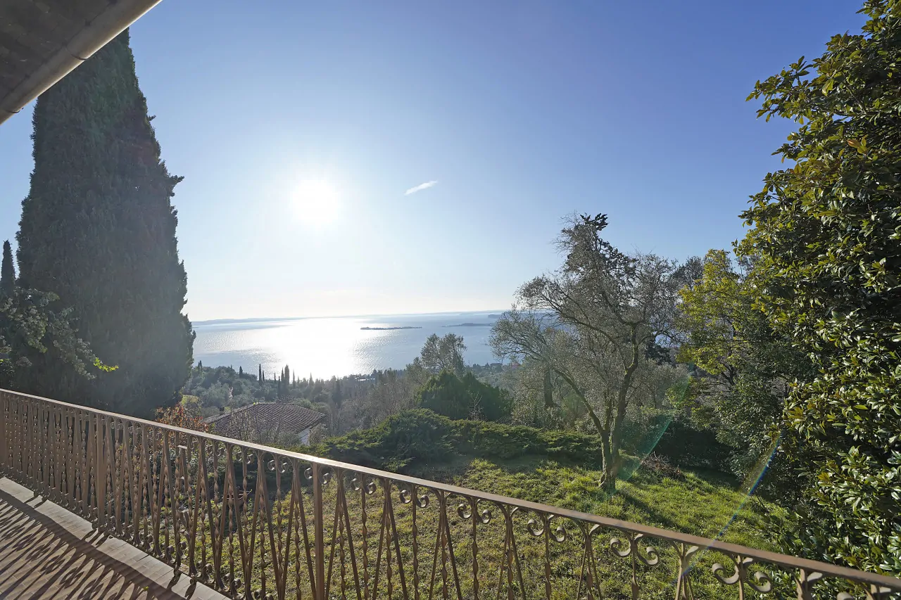 Lake view from terrace with wrought iron railing