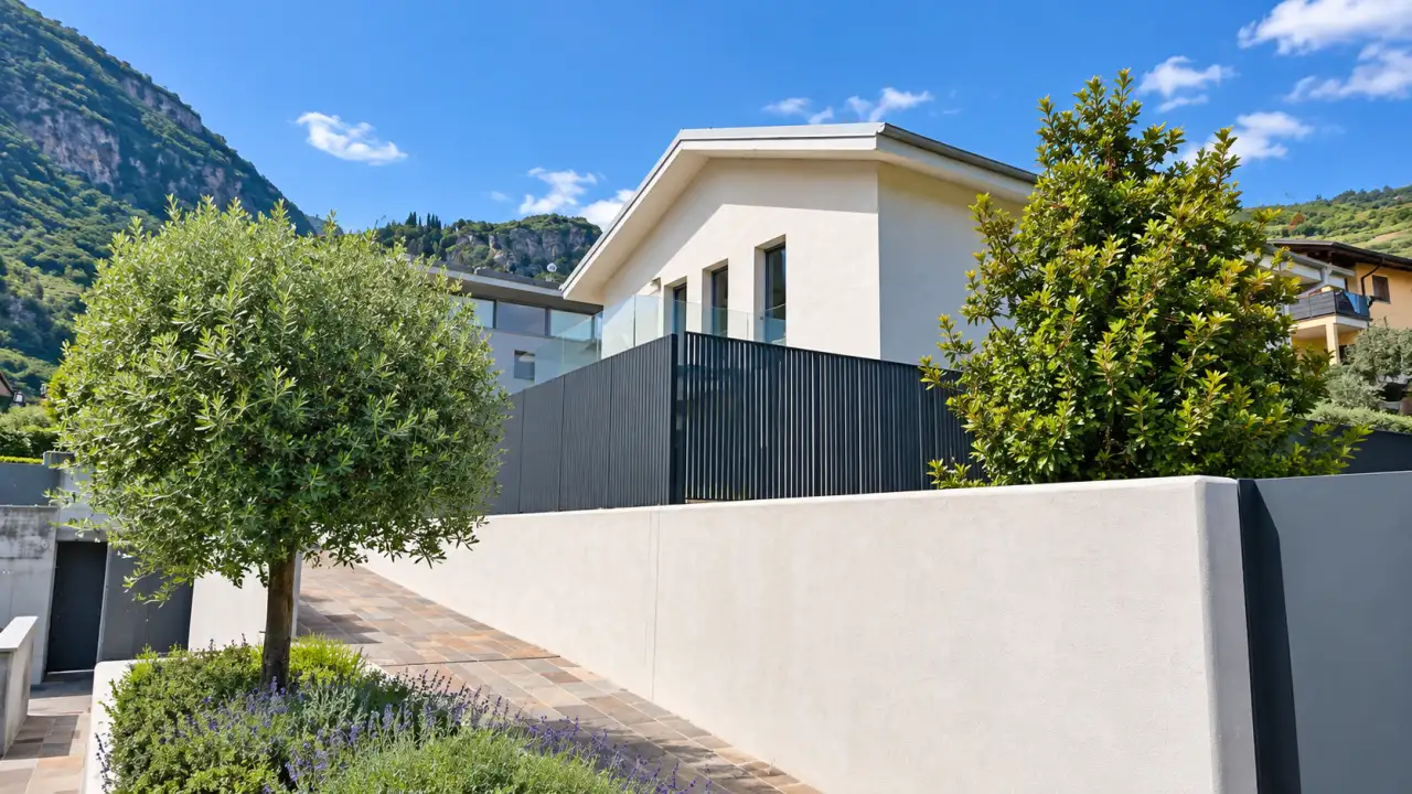 Exterior of the villa with white wall and trees