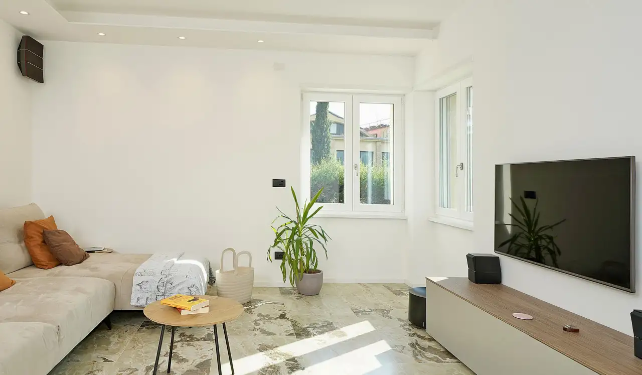 Living room with beige sofa and flat screen TV